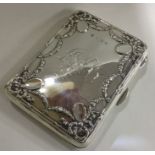 An unusual silver business card holder decorated w