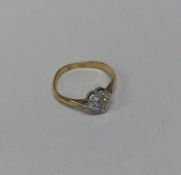 A diamond single stone ring in 18 carat gold heart