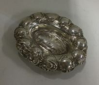 A small silver dish with shell decoration. Birming