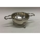 An unusual silver tea strainer on stand. Birmingha