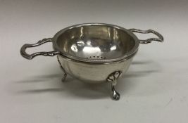 An unusual silver tea strainer on stand. Birmingha