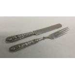 A cast Chinese silver two piece christening set de
