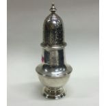 A heavy Georgian silver caster. Maker's mark only.