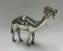 A heavy cast silver figure of a camel. Approx. 185