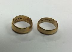 Two good 9 carat plain wedding bands. Approx. 10.7