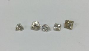 A group of five shaped unmounted loose stones. Approx.