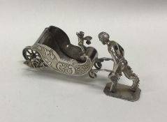 A novelty Victorian silver wheelbarrow bearing imp