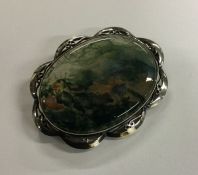 A silver and moss agate brooch. Approx. 28 grams.