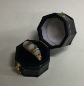 An 18 carat gold opal and diamond half hoop ring i