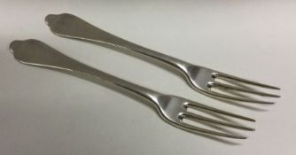 A pair of three pronged silver forks. London 1722.