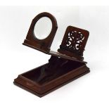 A Victorian mahogany table magnifier with an adjustable rail and plinth base, l.