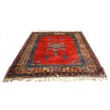 A Moroccan rug with a red and blue ground,