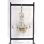 A mid-20th century glass two-tier chandelier constructed of glass lustres and droplets,