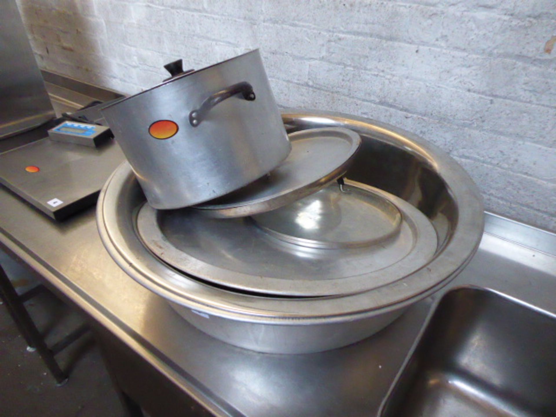 1 Aluminium and 1 stainless steel large mixing bowls, aluminium cooking pot and some platters