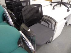 12 chrome cantilever stacking chairs with black plastic back and black cloth seats