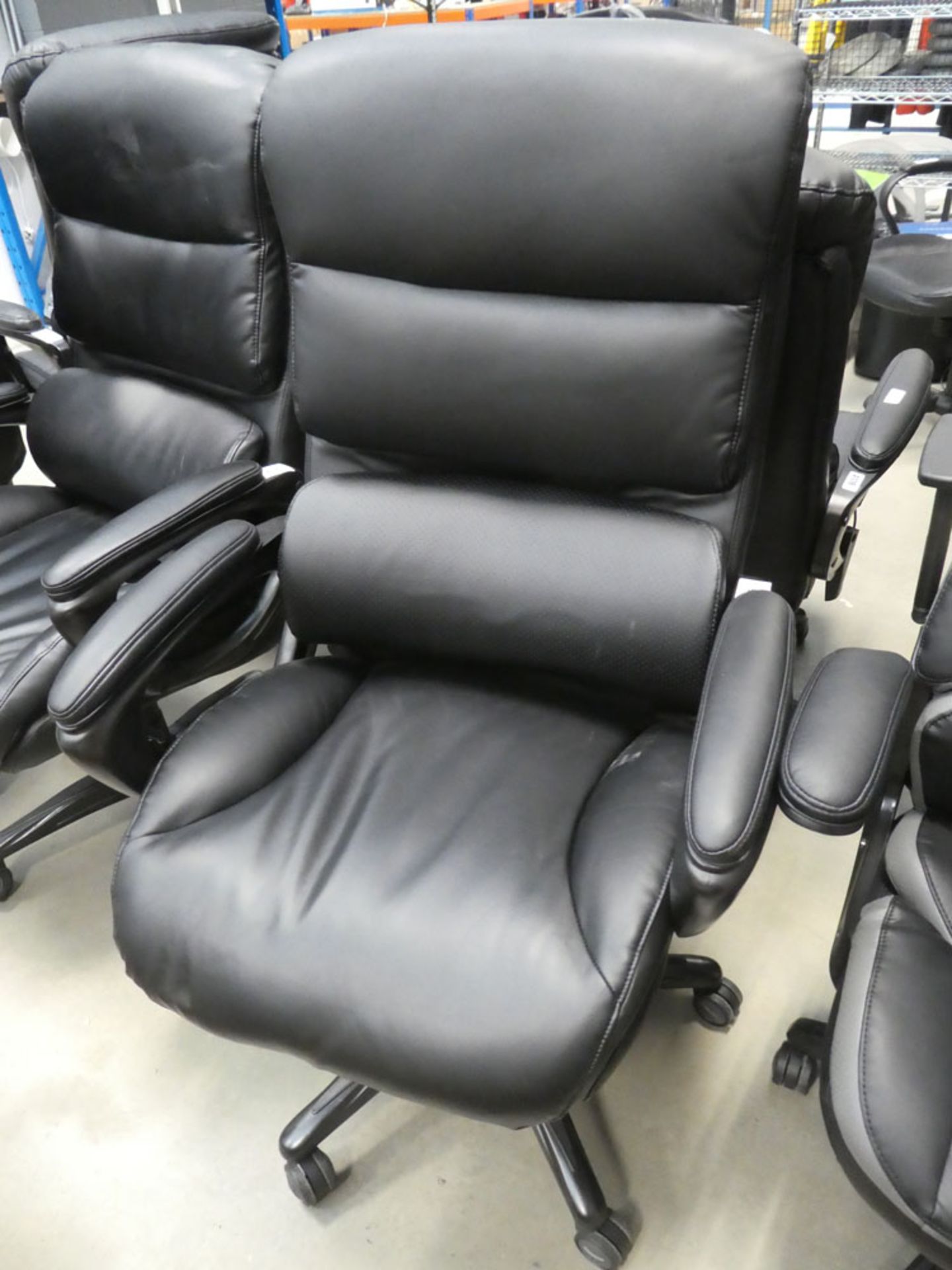 Black highback executive style swivel armchair