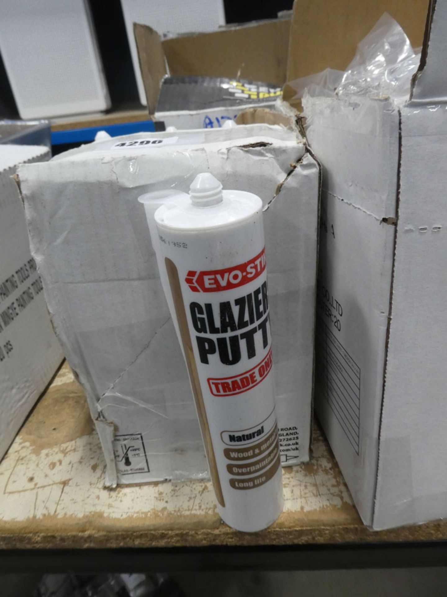 Box of glazing putty, box of silicon, and quantity of dust sheets