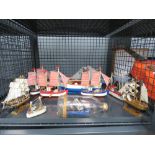 Cage containing ornamental fishing boat