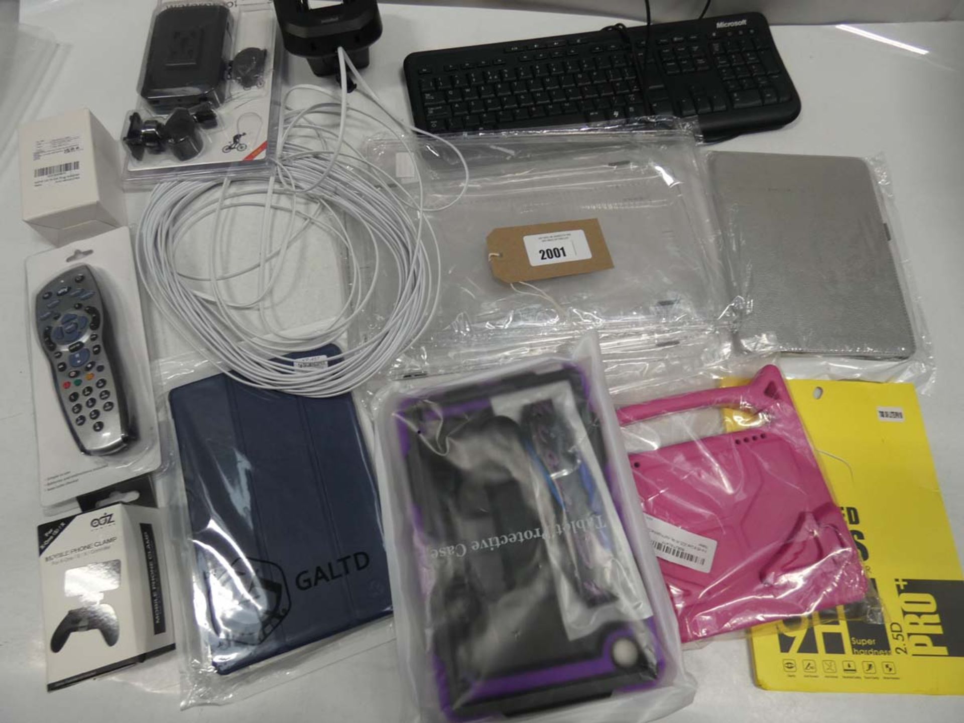 Bag containing tablet cases/covers, remote, cables, keyboard, chargers, etc