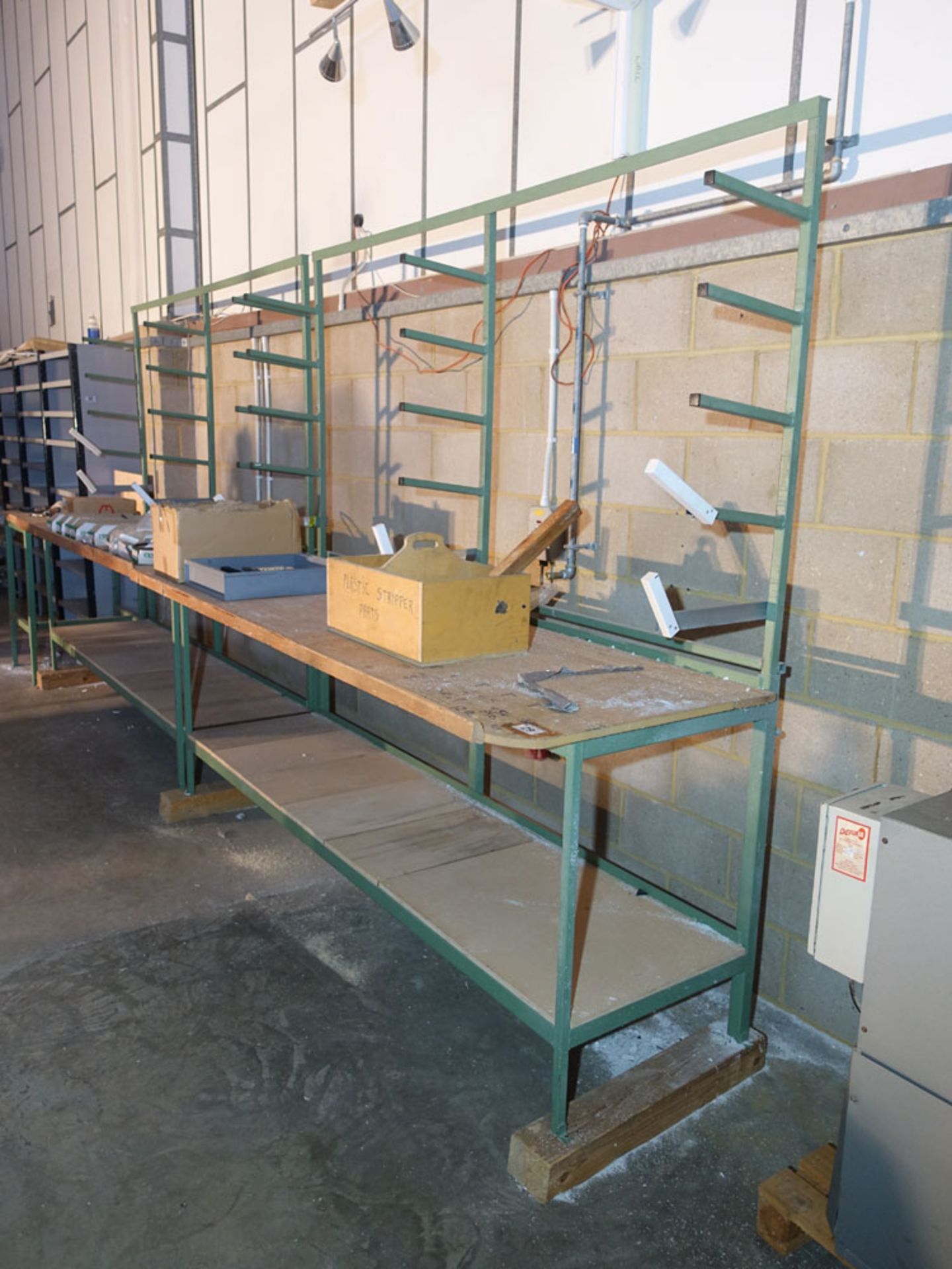 Two 2.5 metre welded steel workbenches with rear bead racking