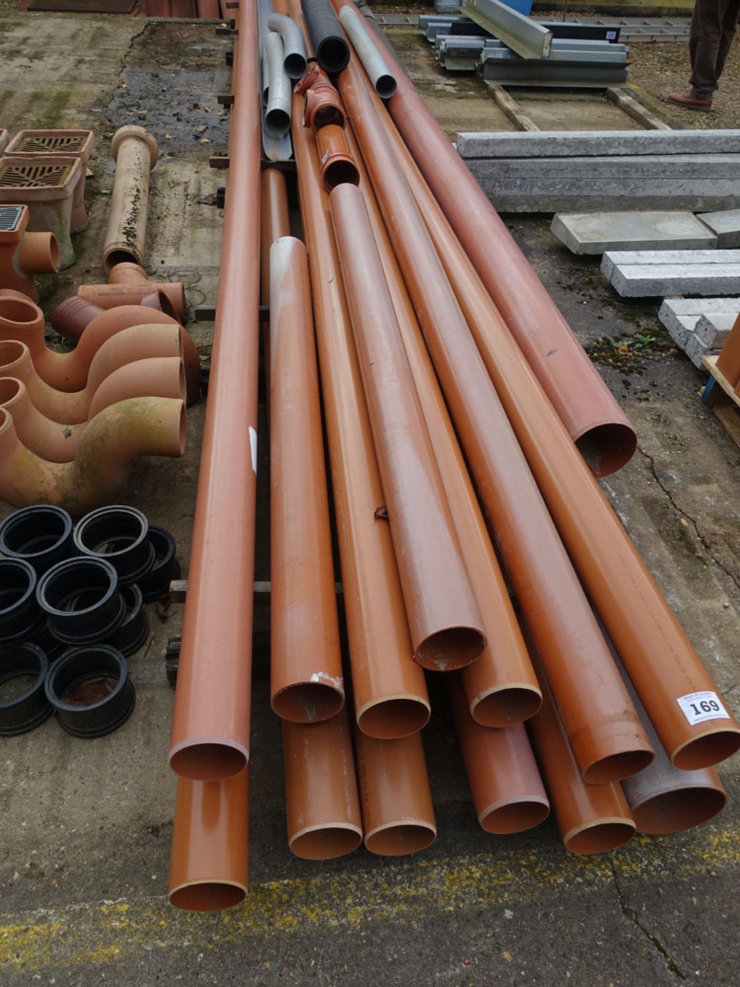 Approximately 10 lengths of 4'' and 6'' plastic drainage pipe together with a range of fittings