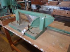 Modern hand operated mitre cutter mounted on bench
