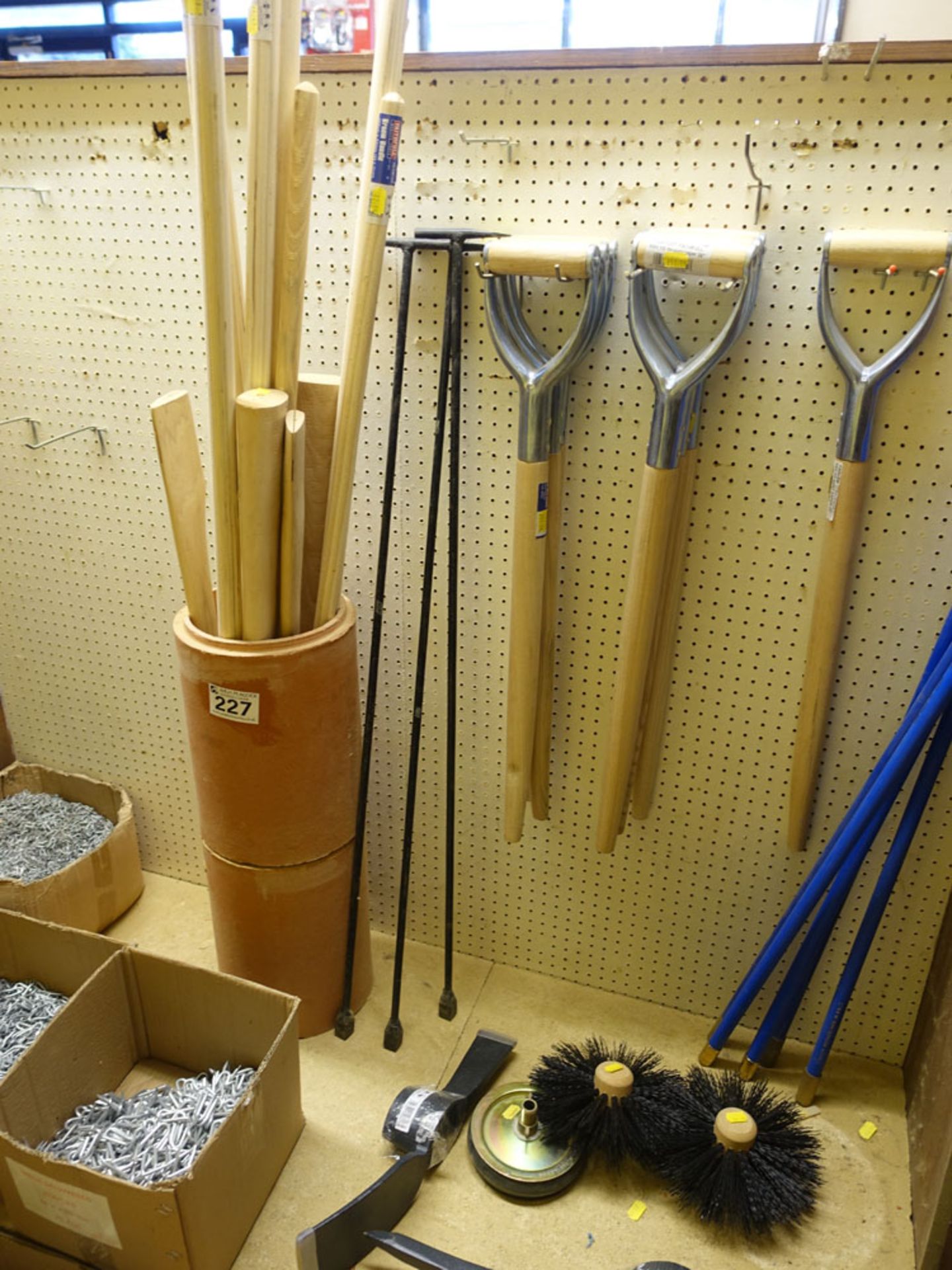 Quantity of wooden tool handles, drain rods, pick heads, stopcock taps, etc