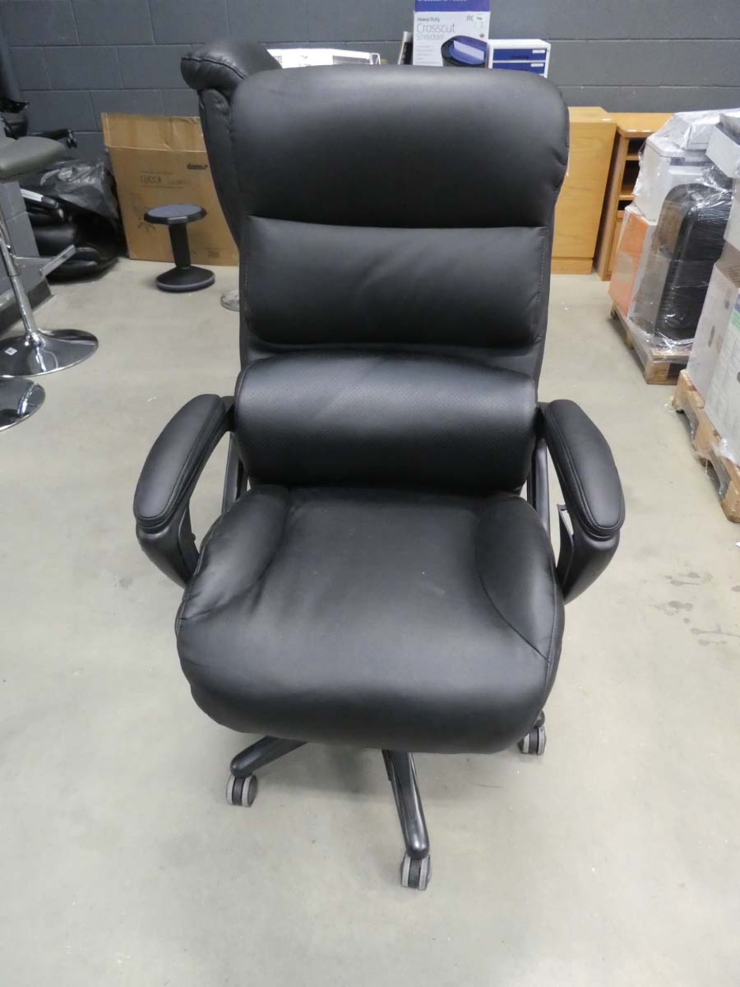 Black highback executive style swivel armchair