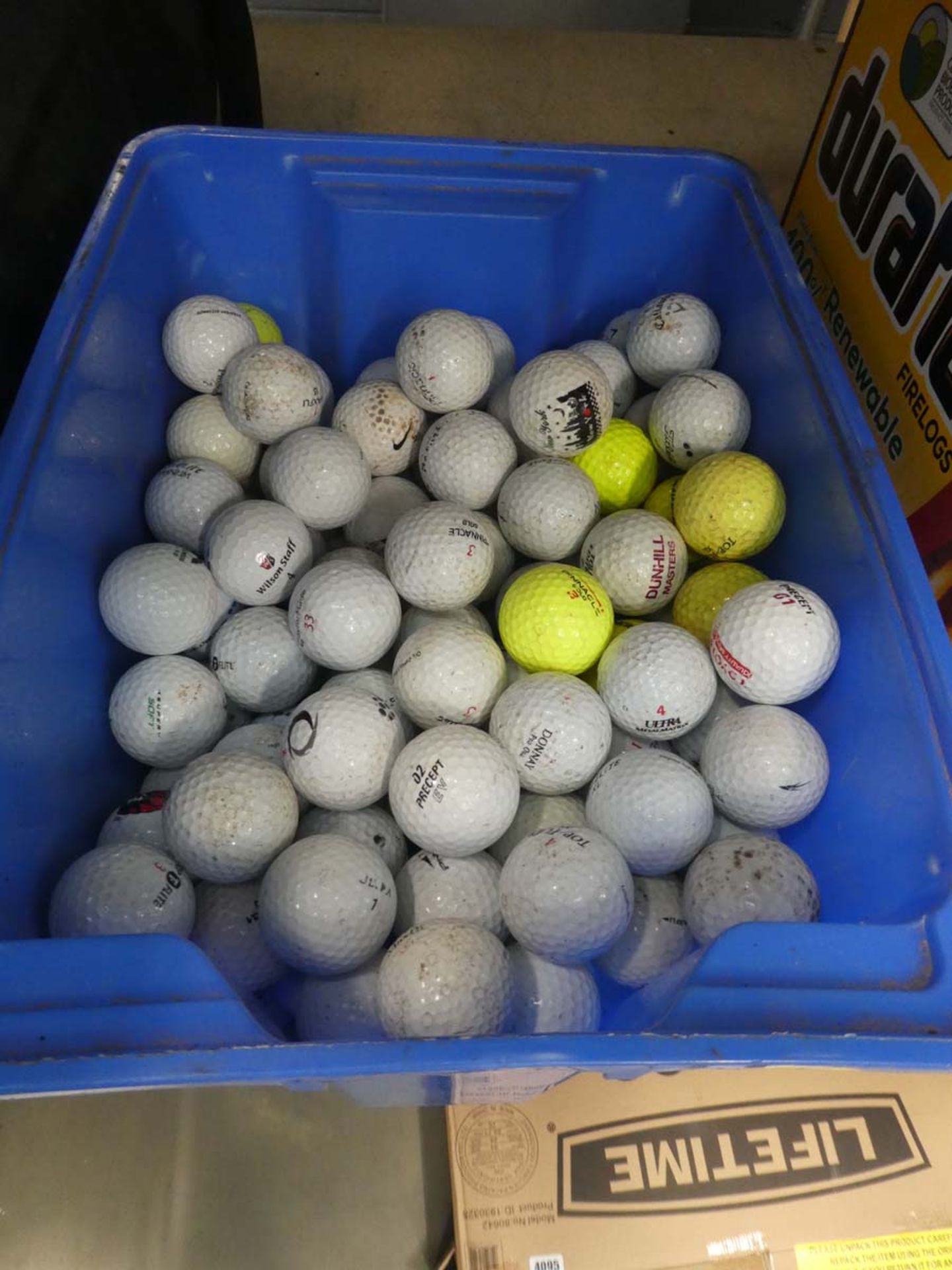 Box of assorted golf balls