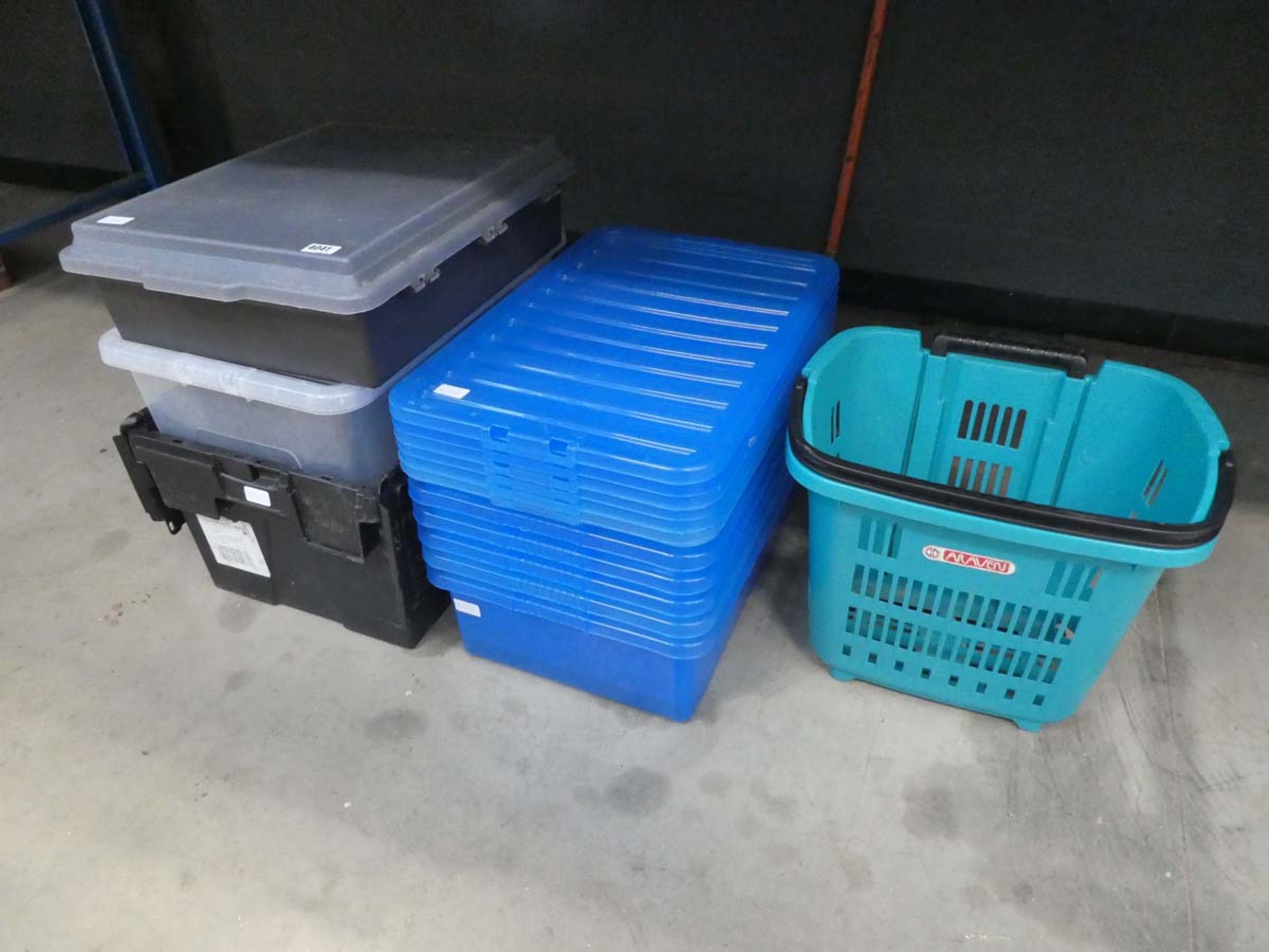 Quantity of blue, black and clear storage boxes and a small basket