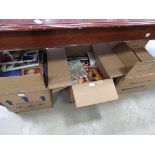 3 boxes containing a large quantity of paperback novels and reference books