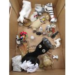 Box containing ornamental cat figures