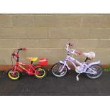 Childs pink and childs red bike