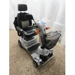 Quingo Plus mobility scooter with associated bag, key, charger and the owners welcome pack