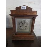 Chiming oak cased mantle clock