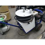 Bleu and white petrol powered pressure washer on wheels