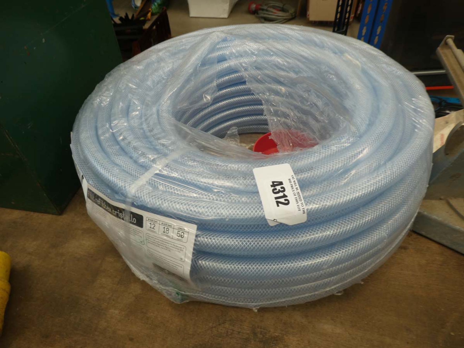 Coil of clear plastic hose