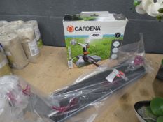 Gardena sprinkler and a skate board bed
