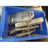 Box containing clamps, and drill bits