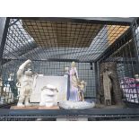 Cage containing Heredities figure, Faerie Realm figure, Discworld figure and drums