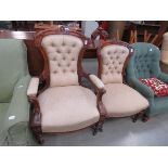His & Hers brown button back easy chairs
