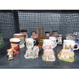 Cage containing ornamental Lilliput Lane cottages, commemorative mugs, Toby jugs and Japanese book