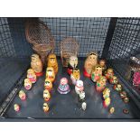 Cage containing Russian dolls and 2 miniature peacock chairs