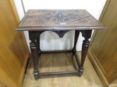 Occasional table with carved top