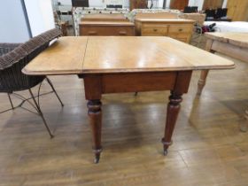 Oak drop leaf table on turn supports