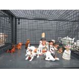 Cage containing miniature Toby jugs and puppies