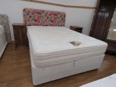 5ft double bed on divan base with floral decorated headboard