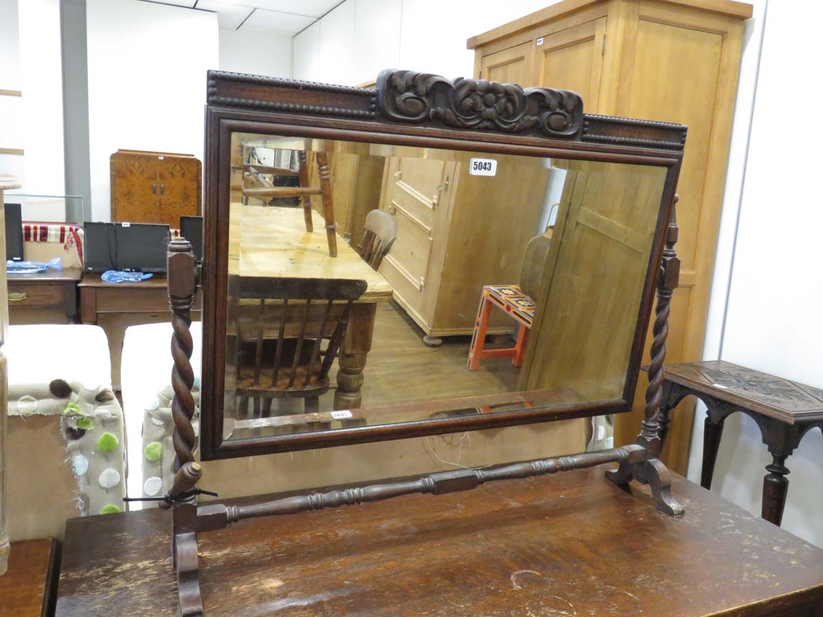 Dark wood carved swing mirror on barley twist supports