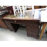 Reproduction mahogany twin pedestal desk with green leather surface