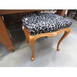 Stool with animal print and gold painted base
